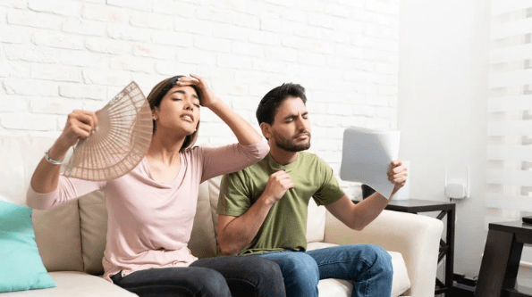 man and woman feeling hot